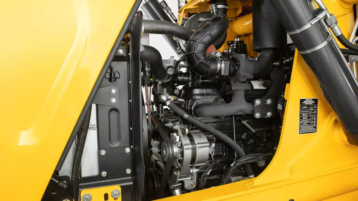 studio photo showing details of the side of the New Holland Construction backhoe loader engine.