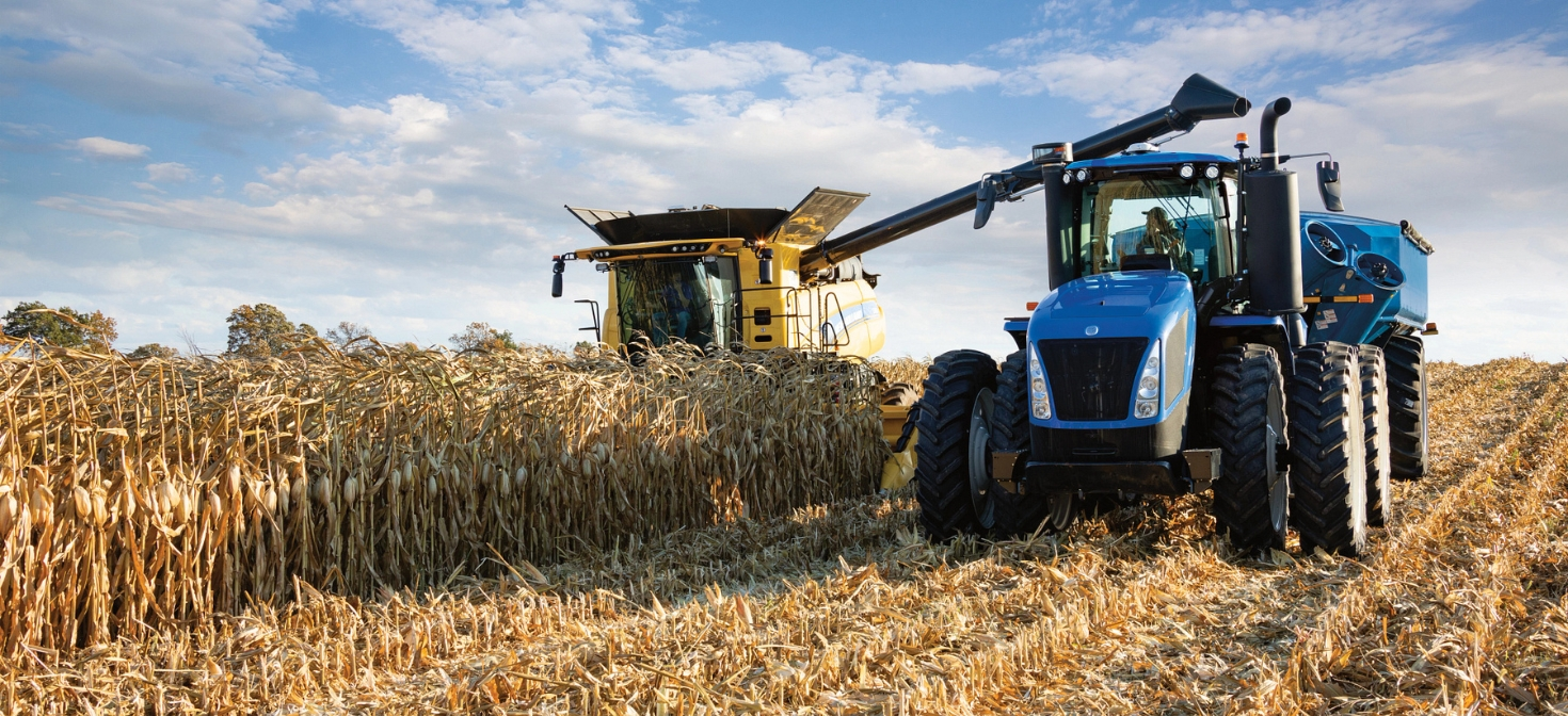 T9 tractor working alongside a New Holland combine in the field