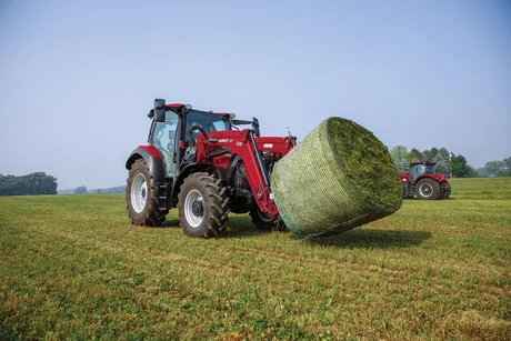 Vestrum 130 tractor with L113 loader and round bale