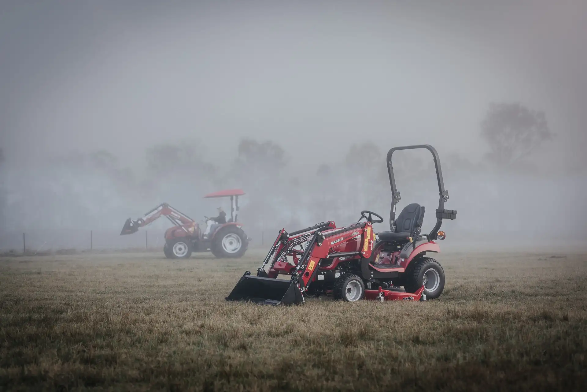Case IH Farmall Subcompact tractor sitting in field with foggy background
