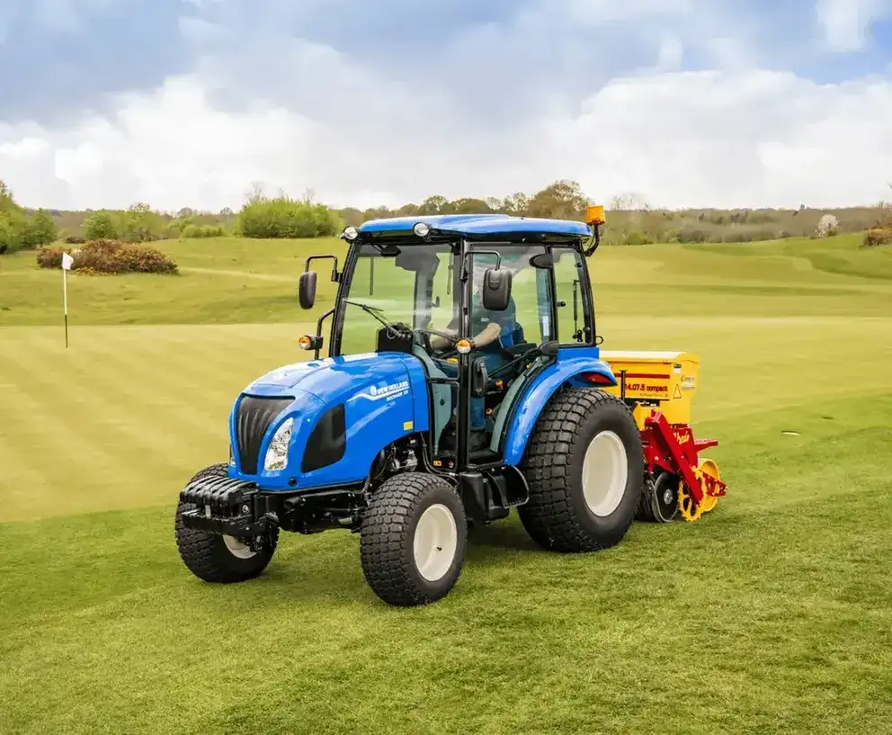 New Holland Boomer Series 50 Cab compact tractor sitting in field