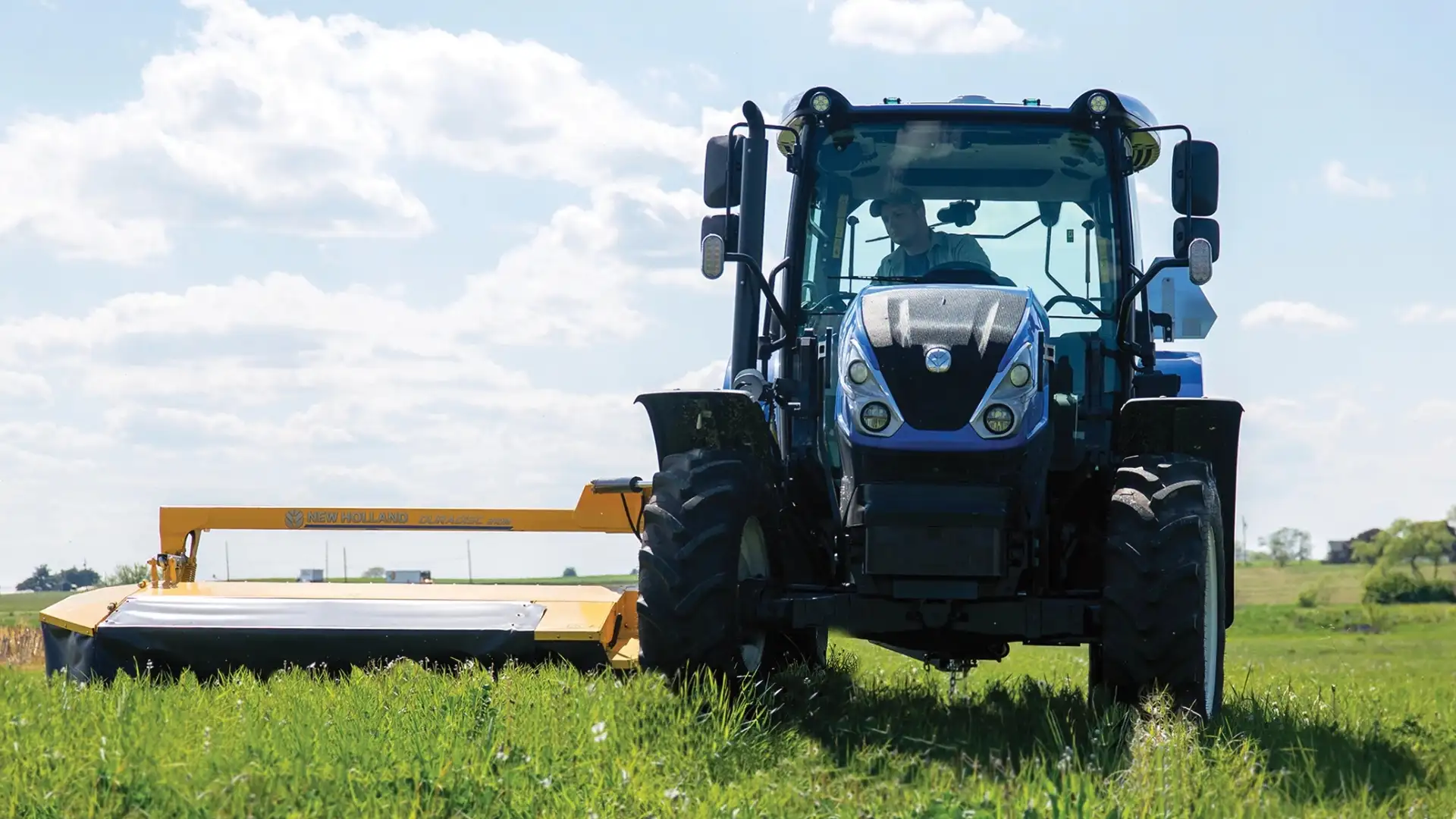 WorkMaster tractor pulling mower.