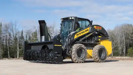New Holland Construction L328 with snow blower attached.