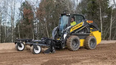 New Holland Construction L328 on a dirt path.