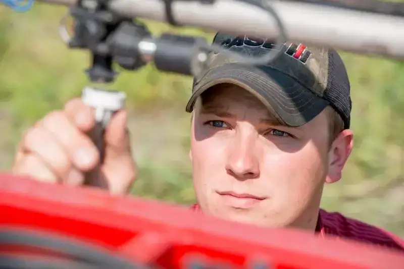 Case IH producer replacing Patriot sprayer nozzle