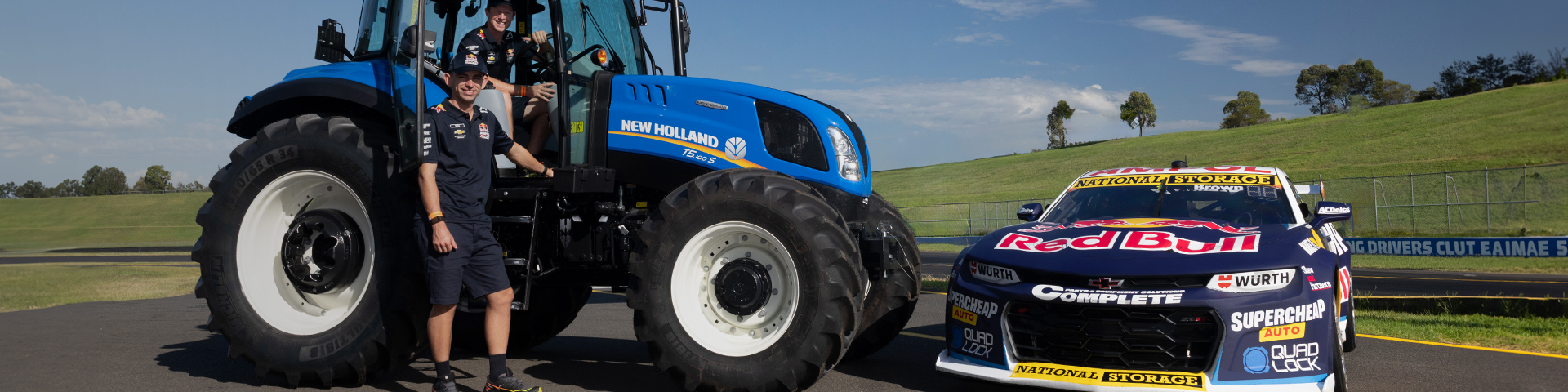 New Holland T7 tractor with Redbull Racing V8 Supercar on track