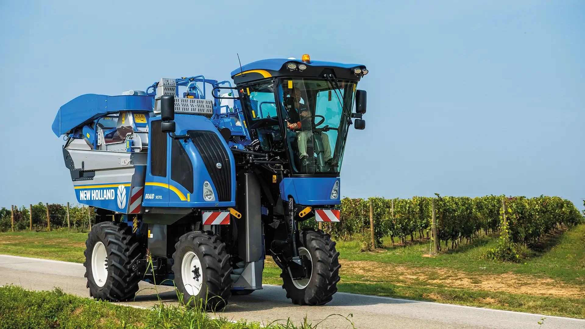 BRAUD 9090X Grape Harvester on the road