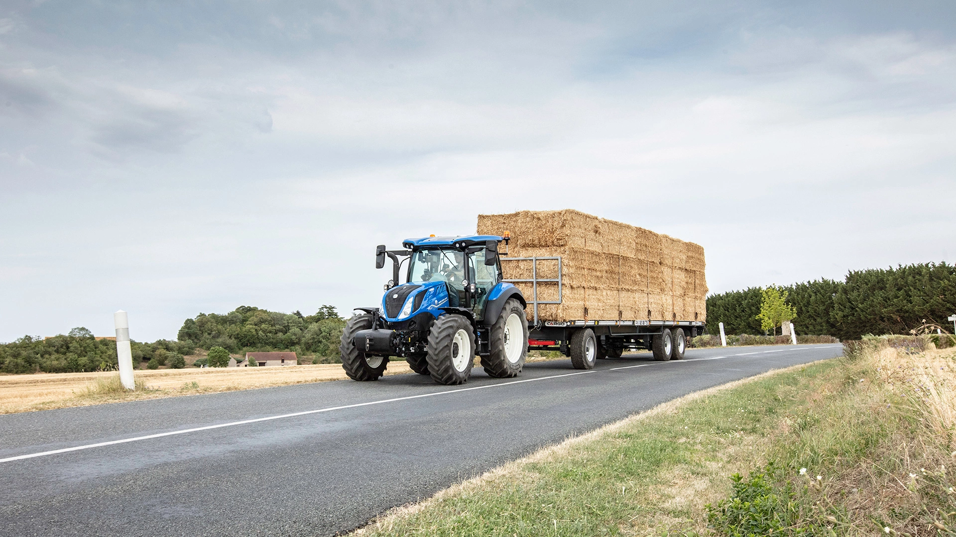 New Holland T5 Dynamic Command & Auto Command agricultural tractor on transportation duties