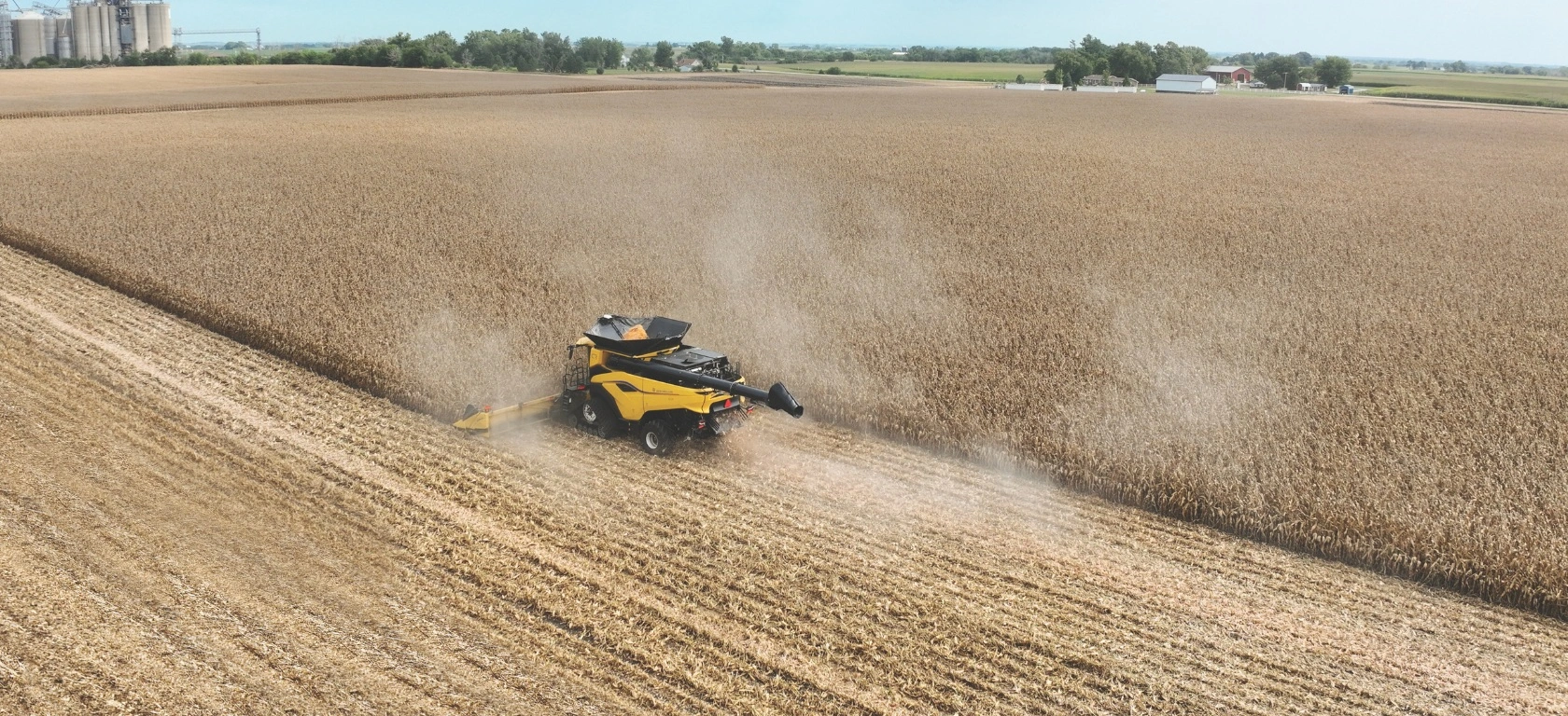 New Holland combine harvester and 9200 series corn head in the field