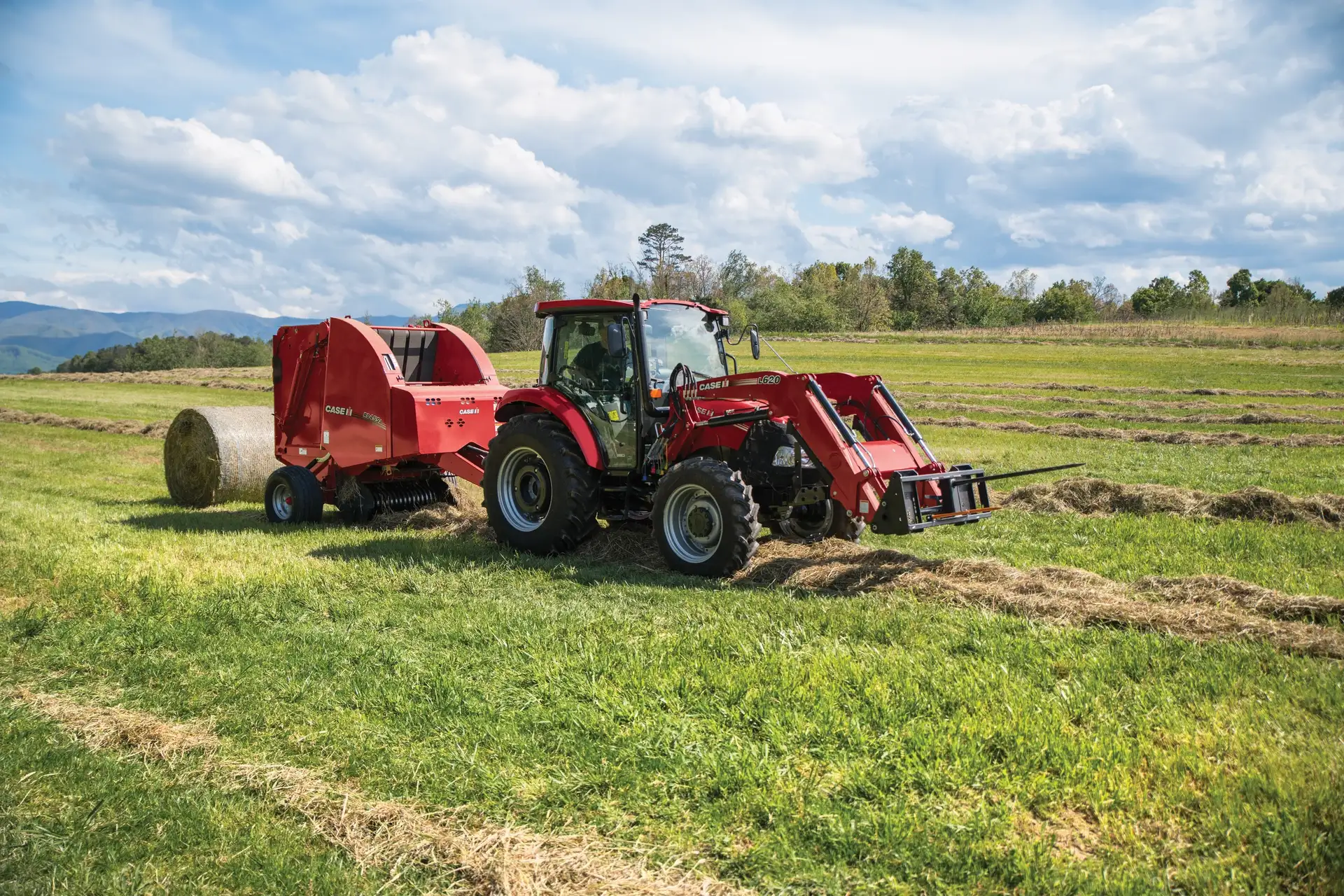 Farmall Utility 75C tractor with L620 Loader and RB455A Round Baler.