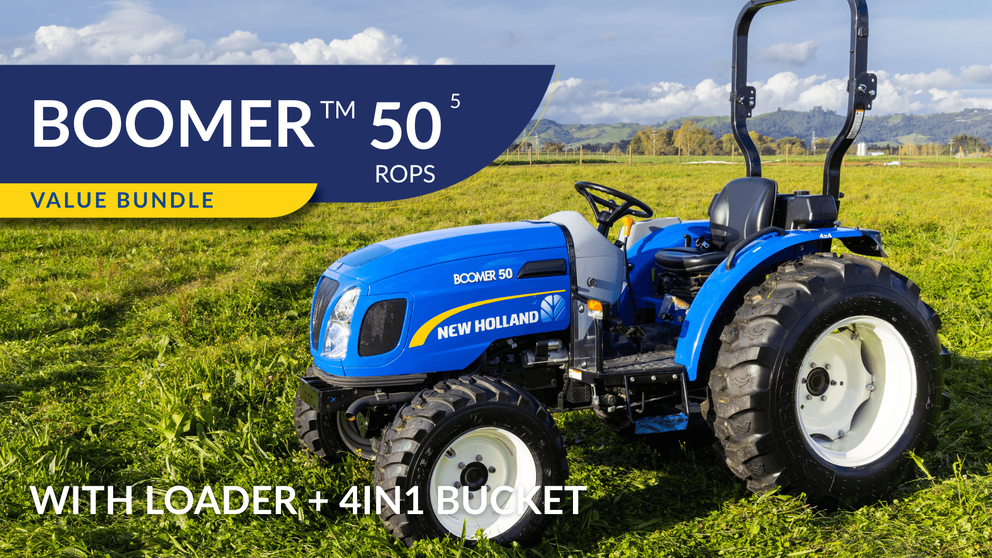 New Holland Boomer 50 ROPS tractor sitting in field with operator