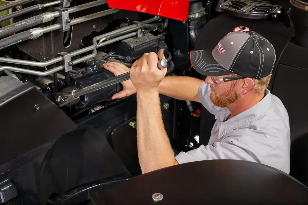 Case IH technician with wrench