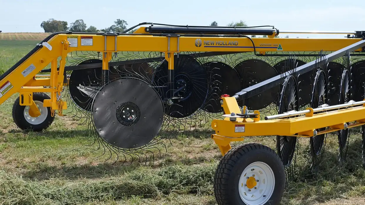 New Holland DuraVee trailing rakes working in field