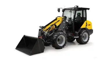 Small articulated loader from side.