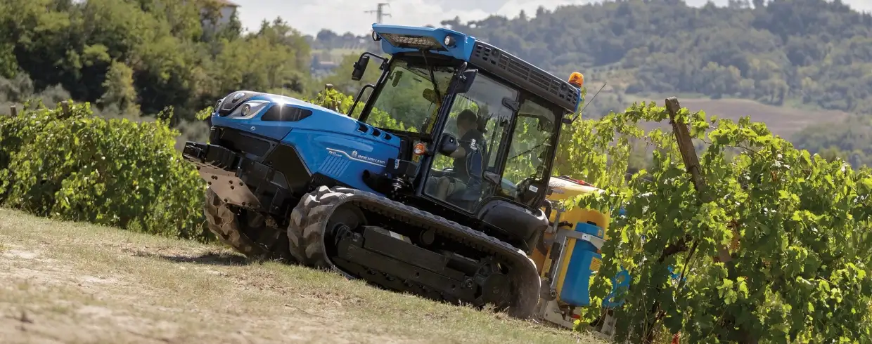 TK4 Crawler tractor climbs a hill