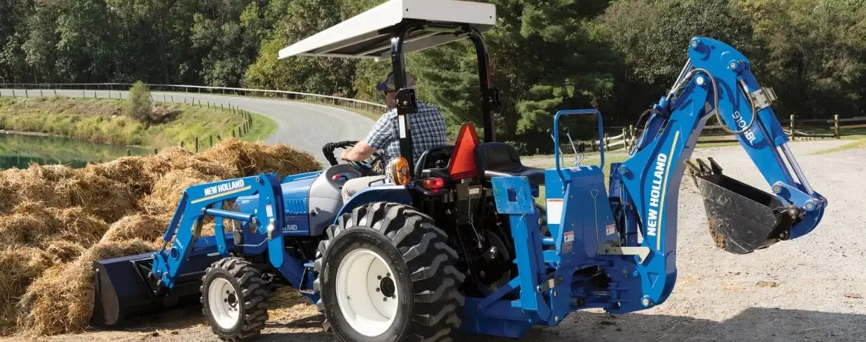WORKMASTER compact tractor with loader and backhoe attachments