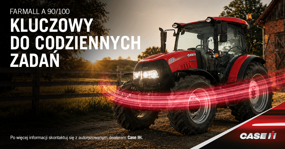 Ciągnik Case IH Farmall A 100 zaparkowany na gospodarstwie o zachodzie słońca z efektownymi świetlnymi smugami wokół kół.