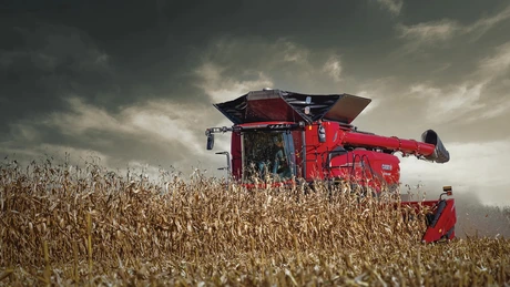 AF9 Combine in field with c516 header and dark sky