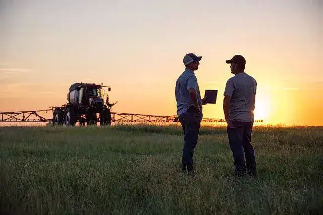 producer with ipad in front of patriot sprayer