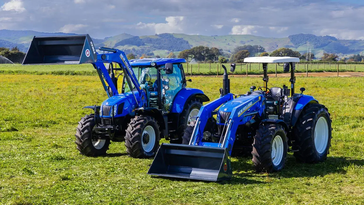 New Holland T6000 Tier 3 tractor sitting in New Zealand field, with loader configuration