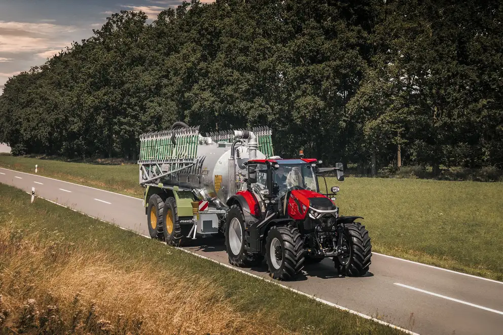 Red Case IH Puma next generation tractor on road with implement