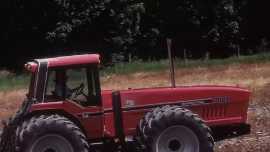 International Harvester produces the innovative 2+2 row crop articulated tractor, with the driver seated on the rear half of the tractor.