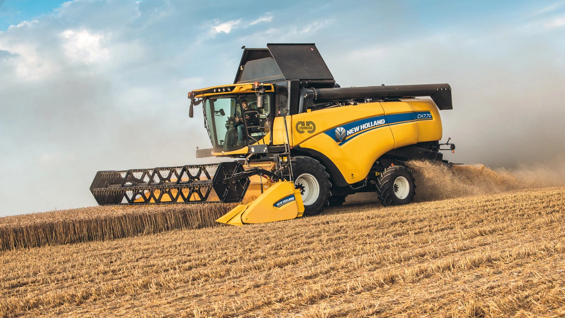 New Holland CH Combine Harvester in action, efficiently harvesting with agricultural combine header