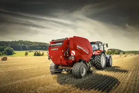Round Balers RB 456466 HD PRO Series in field working with tractor