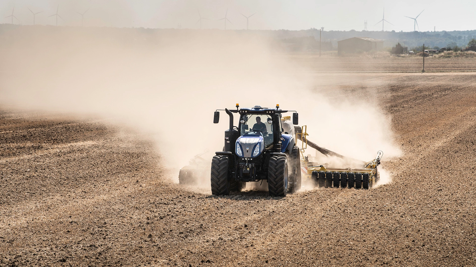T8 Genesis farm tractor in action, cultivating the land