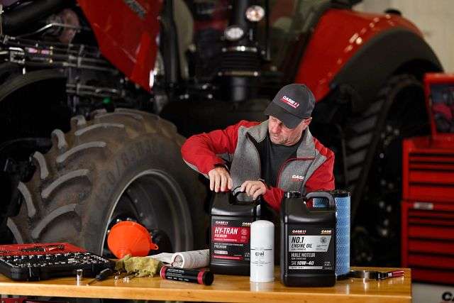 technician opening hy-tran oil container