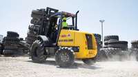 Forklift lifting tires.