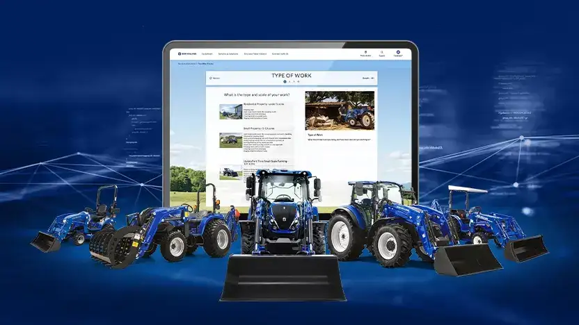 Line up of blue tractors in front of a screen.