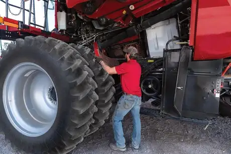 Case IH Technician servicing Axial-Flow 7250
