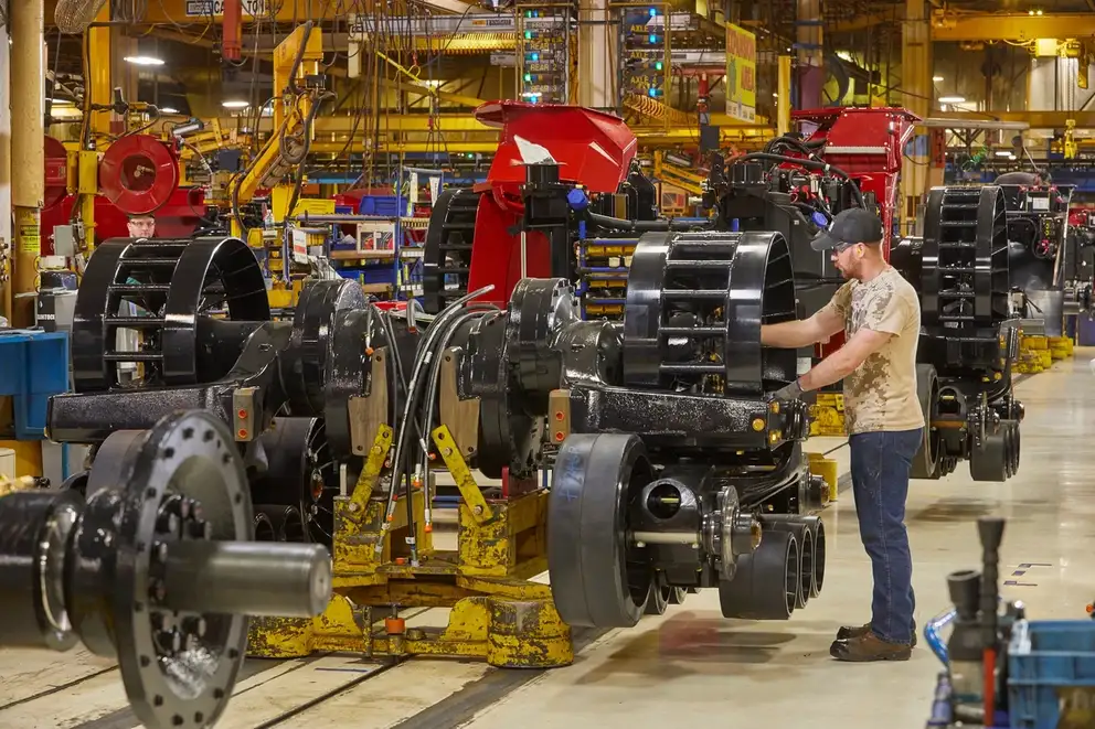 Man assembling Case IH equipment in factory