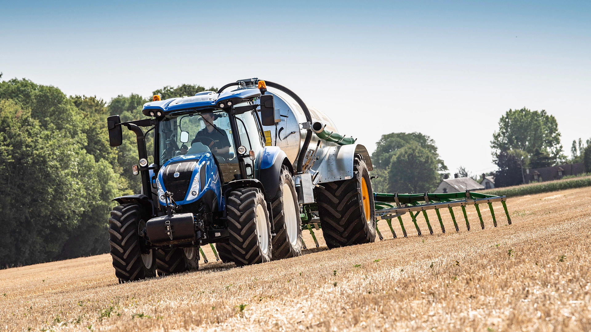 New Holland T5 Dynamic Command & Auto Command agricultural tractor working diligently on the field
