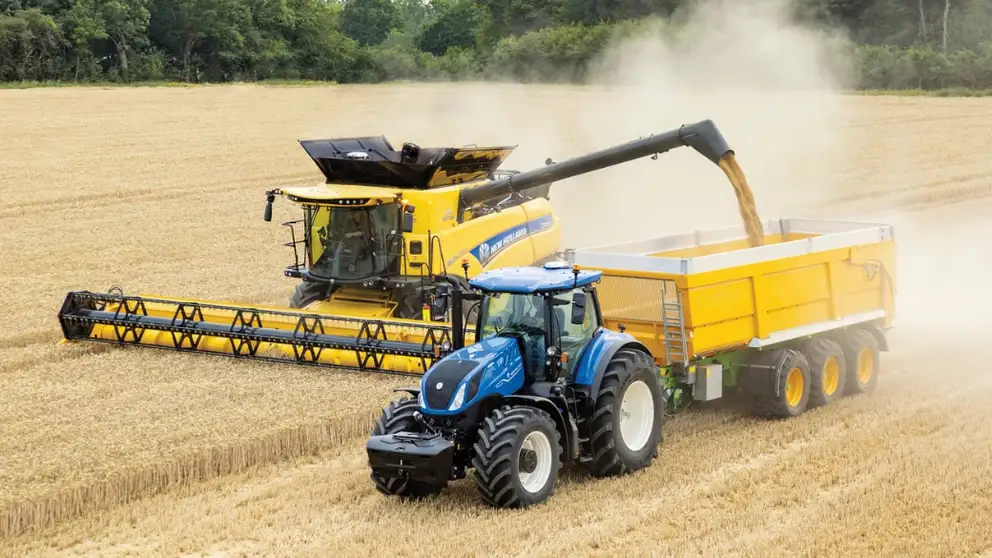 T7 tractor in the field with a combine 