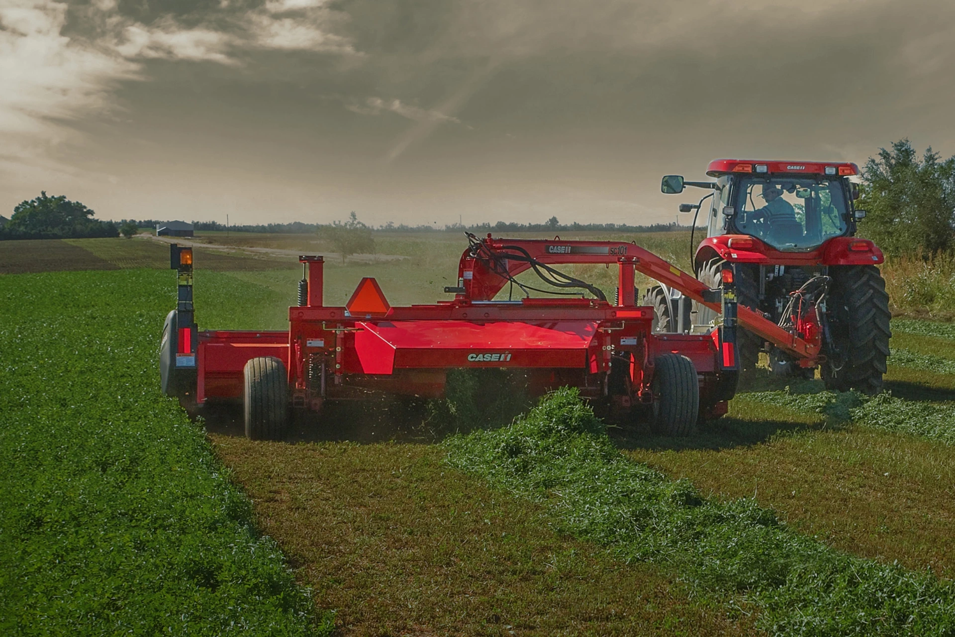 A Case IH tractor and a sicklebar mower conditioner