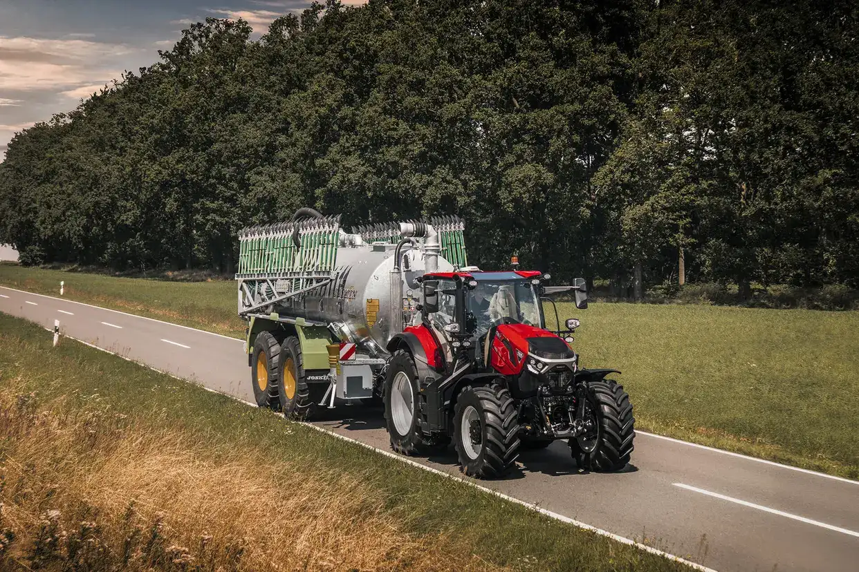 Red Case IH Puma next generation tractor on road with implement