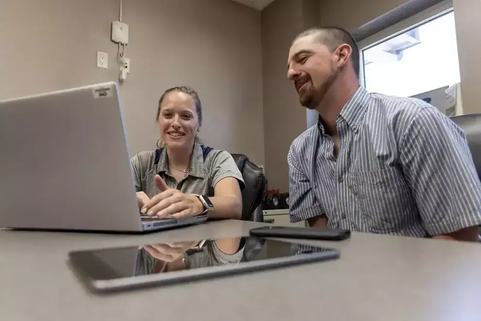 Man and woman sharing laptop