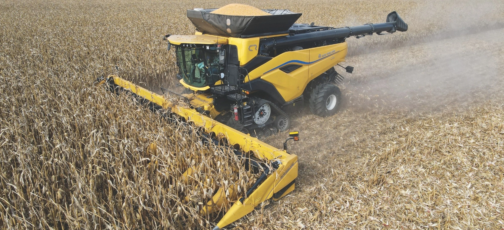 New Holland combine harvester and 9200 series corn head in the field