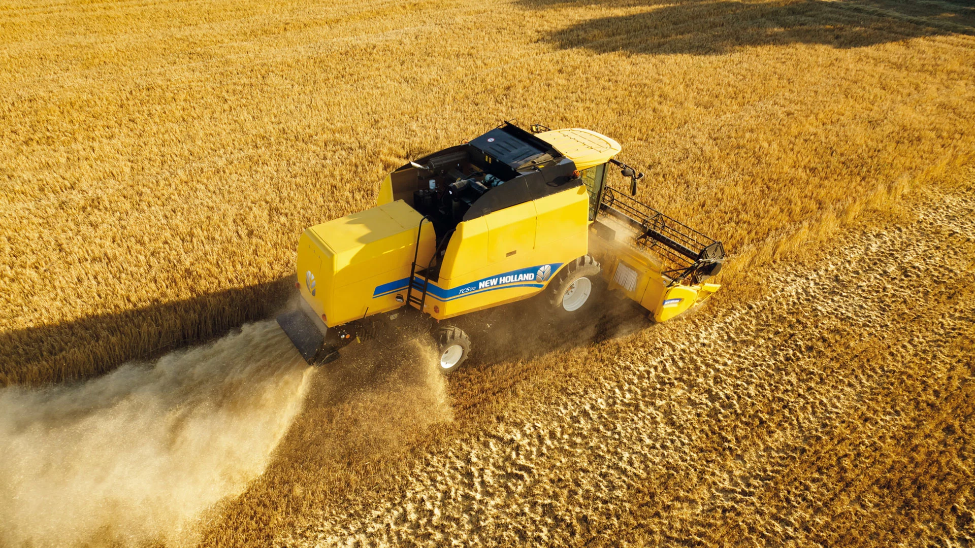 New Holland Combine Harvester TC in action, efficiently harvesting with agricultural combine header