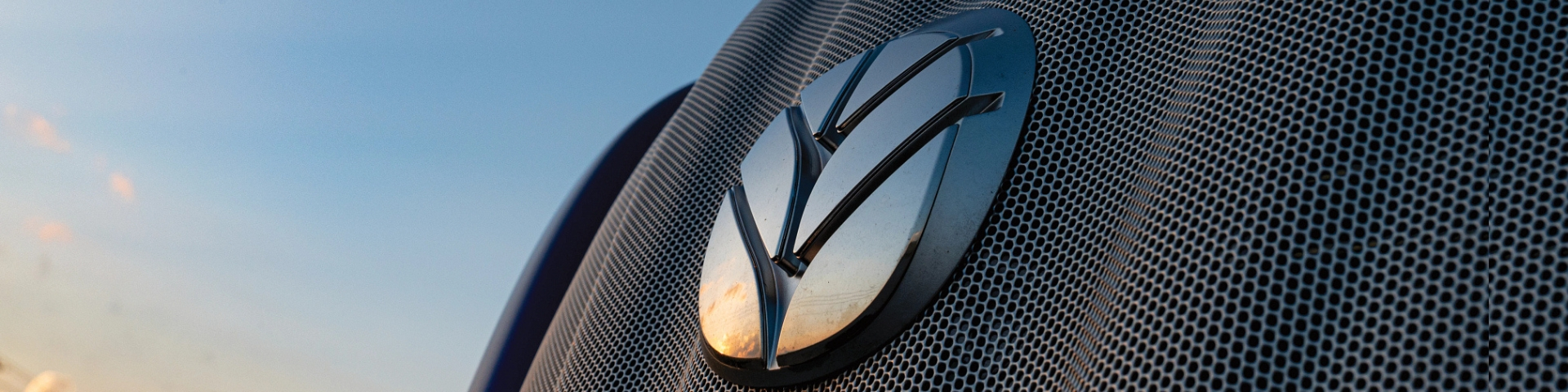 New Holland leaf logo on the hood of a tractor