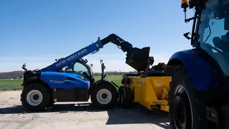Telehandler moving hay.