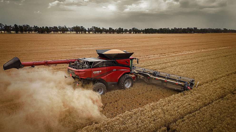 Case IH AF9 Series combine working in field, with dust flicking up in field