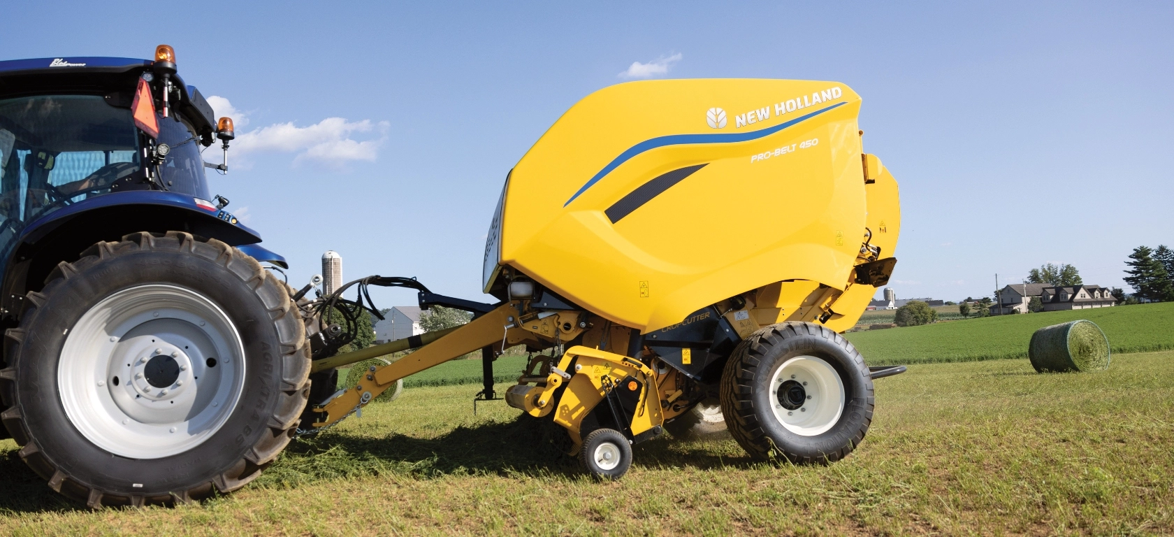 Pro-Belt™ Round Baler connected to tractor hitch