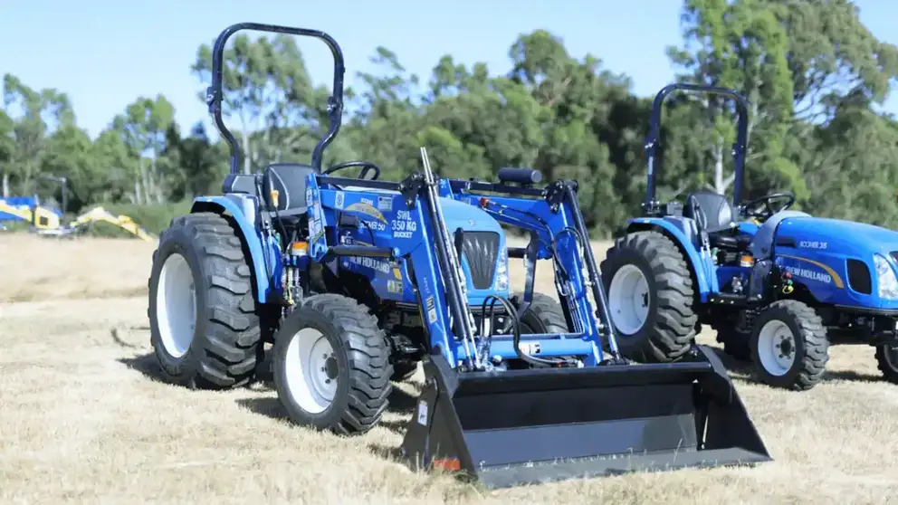 New Holland Boomer tractor sitting in field