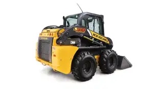 Skid steer loader from the side.