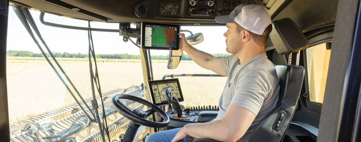 Operator in the cabin of a Next Generation CR Series combine