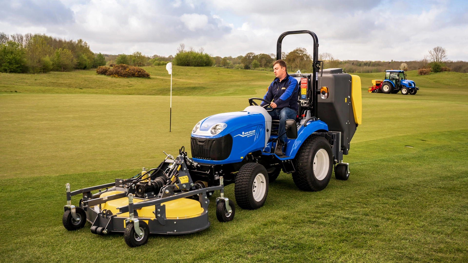 New Holland Boomer agricultural tractor performing duties on a farm field