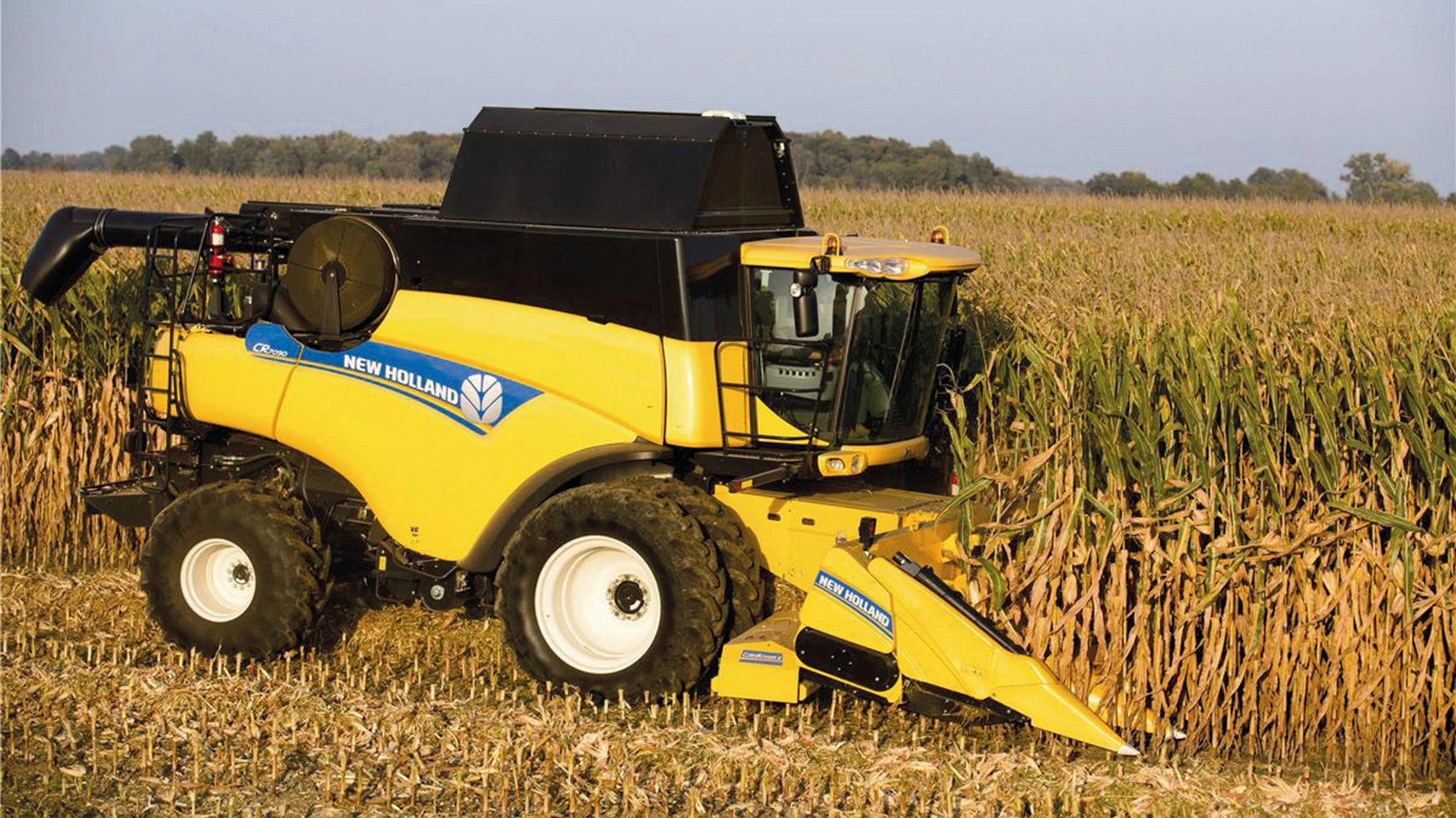 New Holland combine with maize header in action